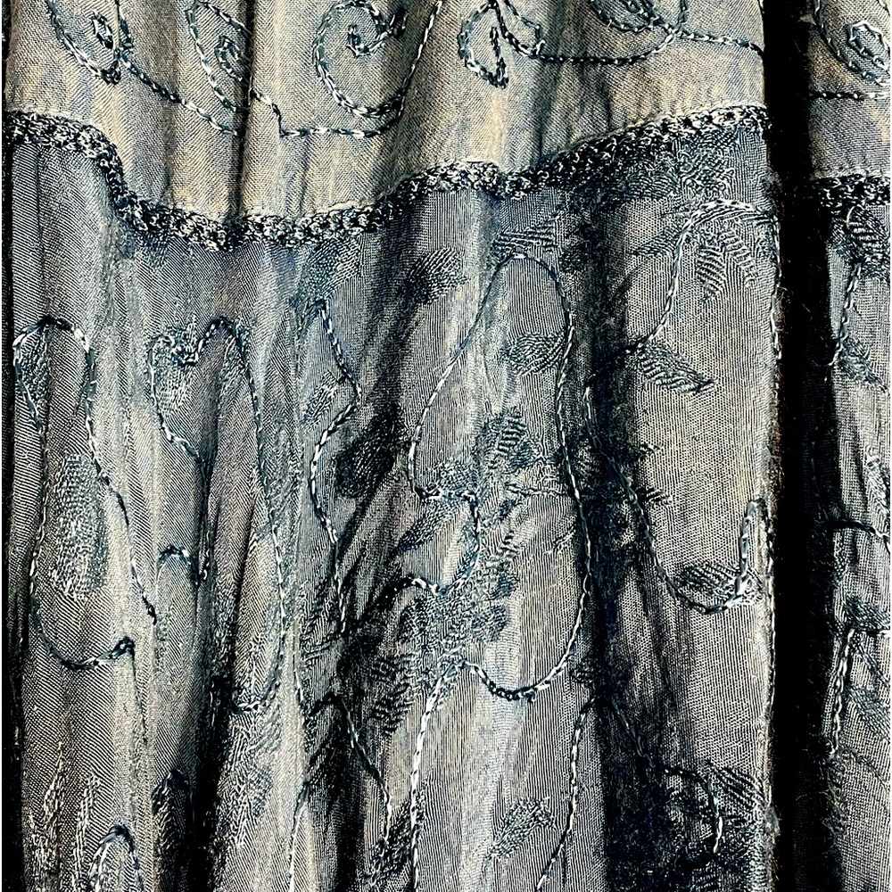 Just Cruising brand. Beautiful blue skirt with detailed stitching on it.